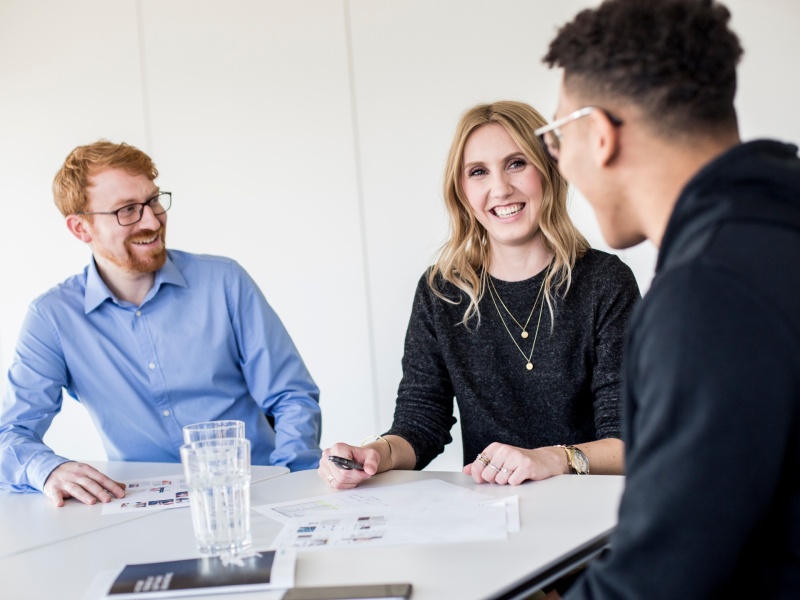 A femal and male adessi in a meeting